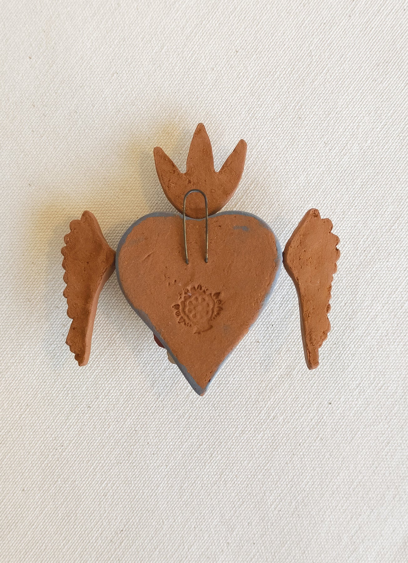 Milagrito fleuri avec ailes