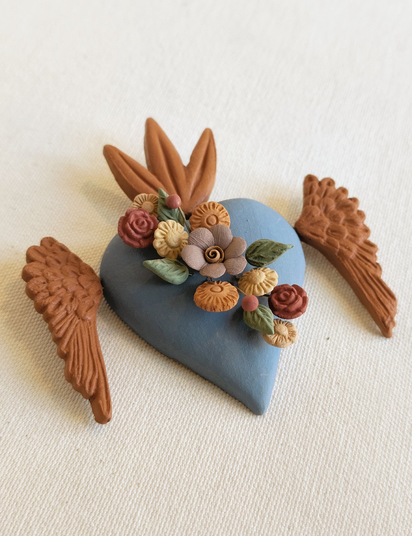 Milagrito fleuri avec ailes