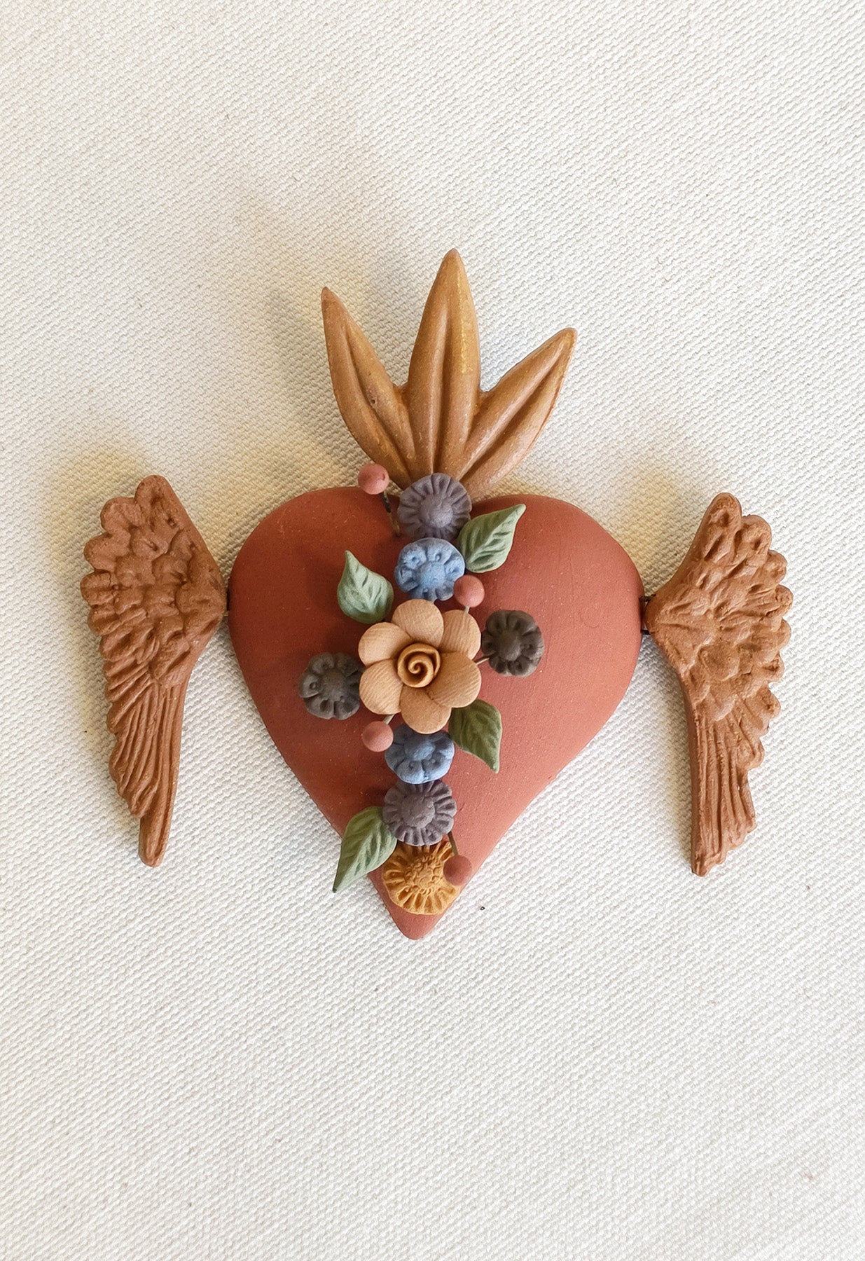 Milagrito fleuri avec ailes