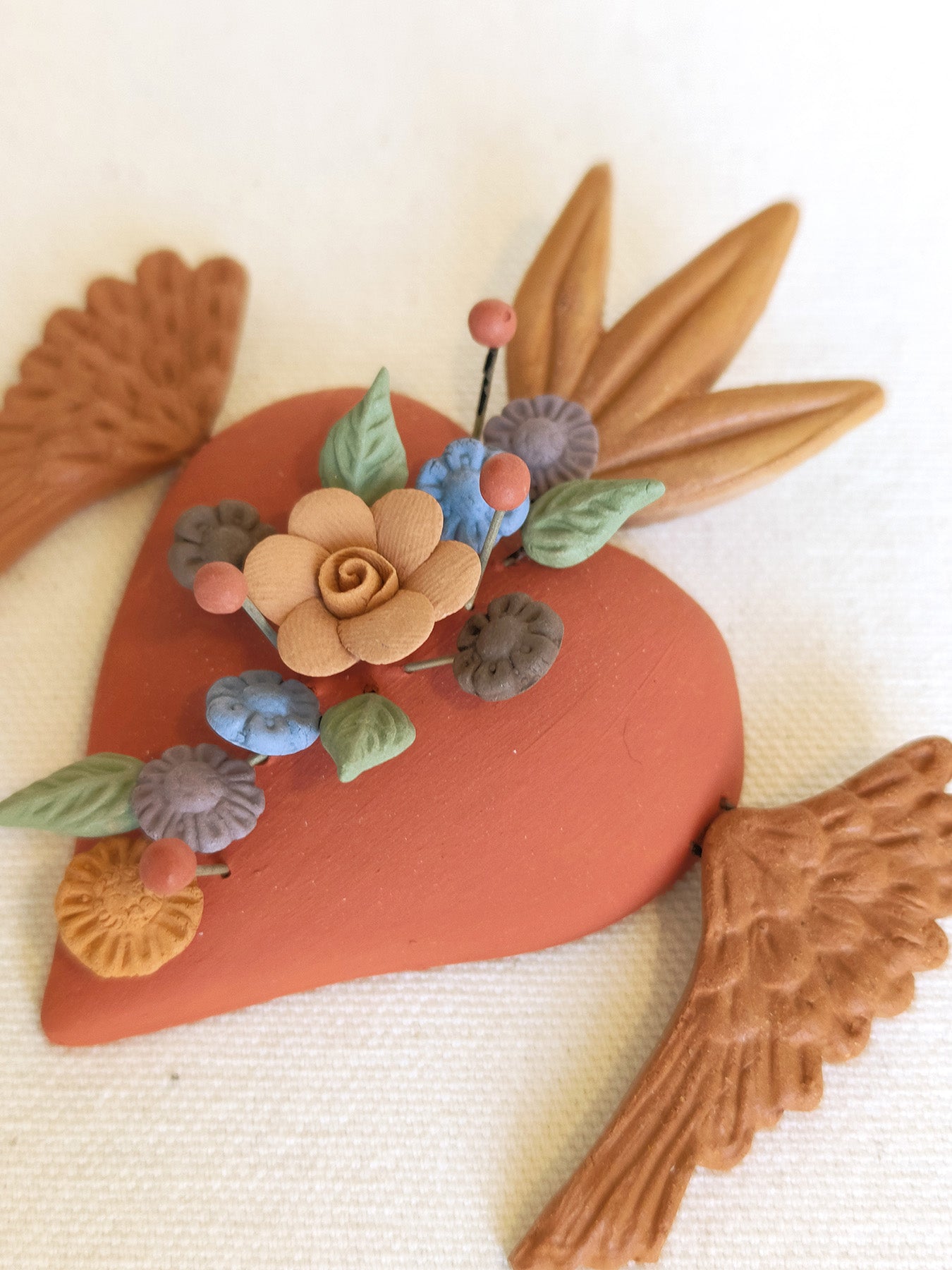 Milagrito fleuri avec ailes