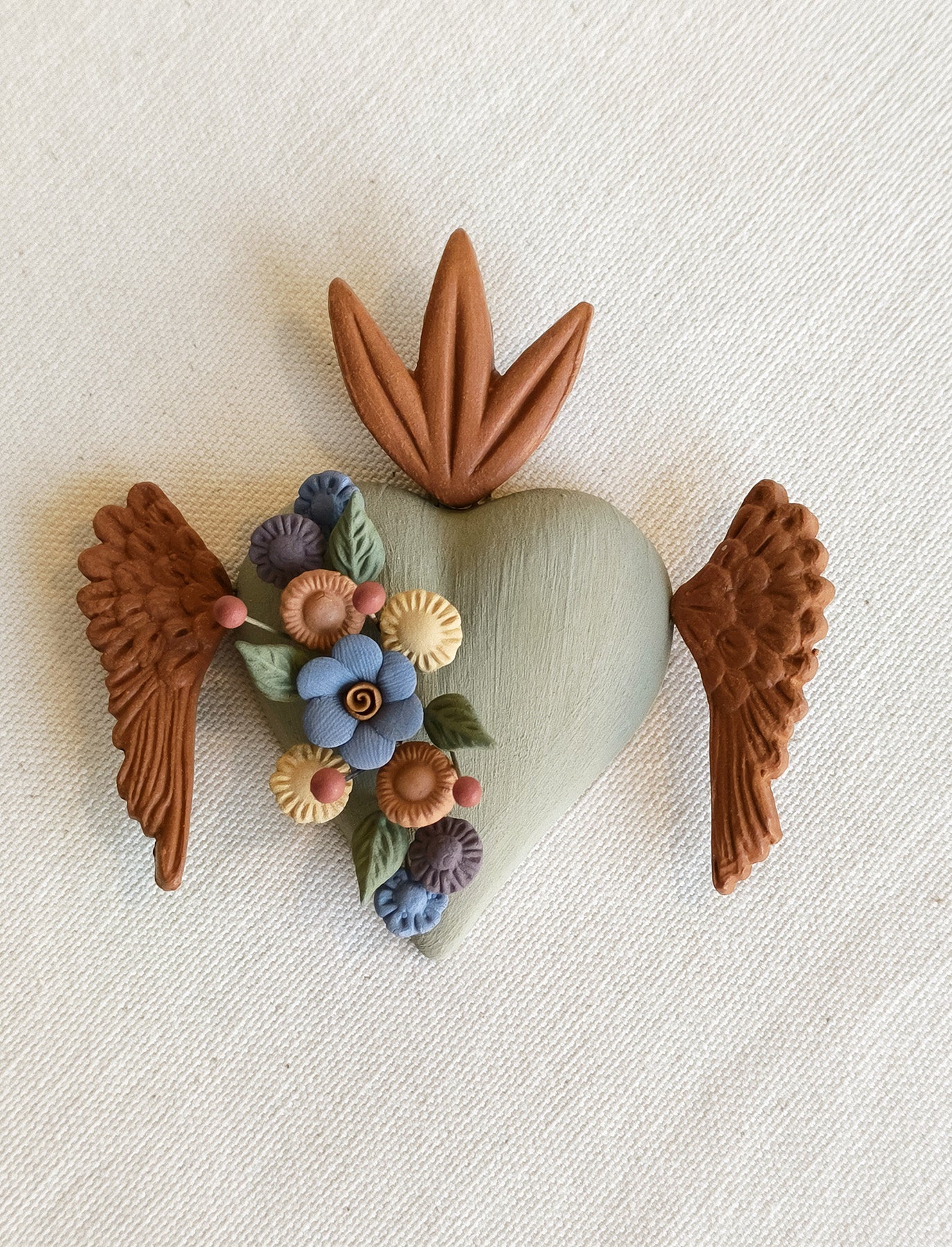 Milagrito fleuri avec ailes