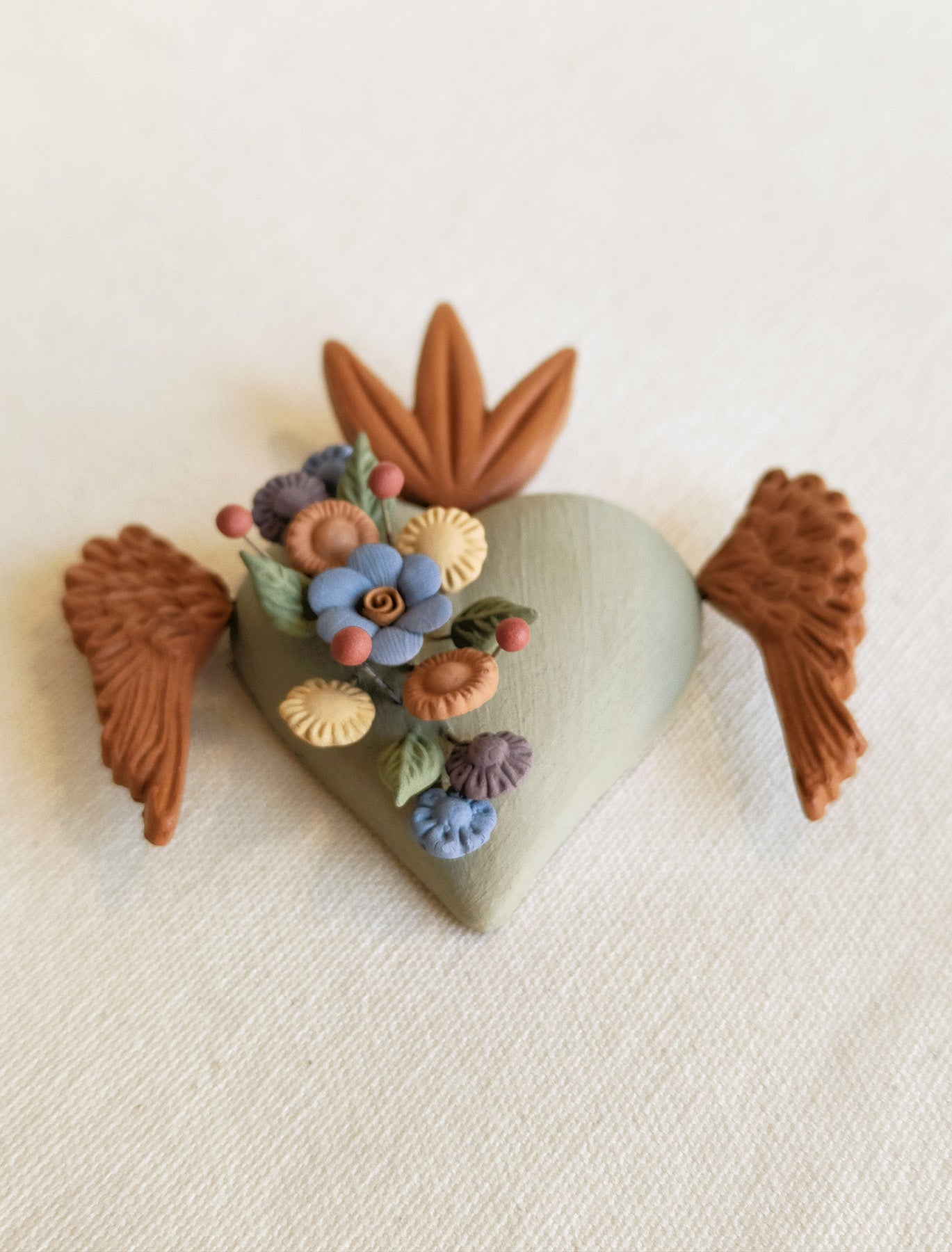Milagrito fleuri avec ailes
